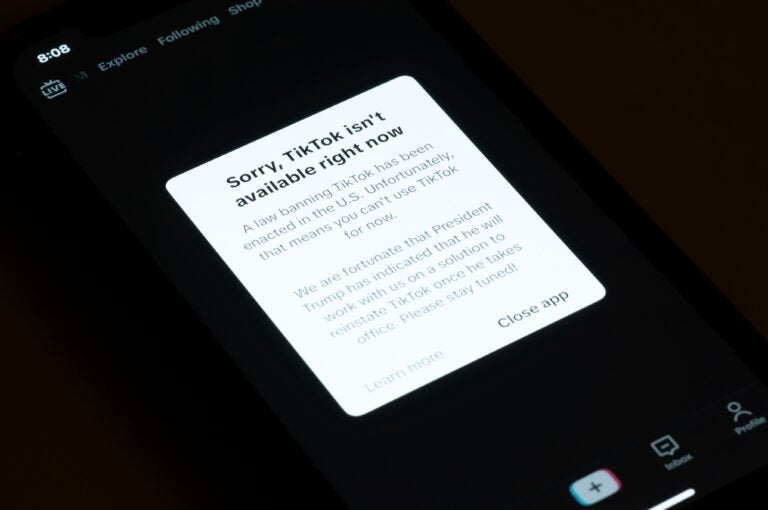 A message reading Sorry, TikTok isn't available right now is displayed from the TikTok app on a cell phone screen