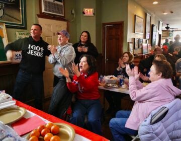 Trump supporters watching his speech in the bar