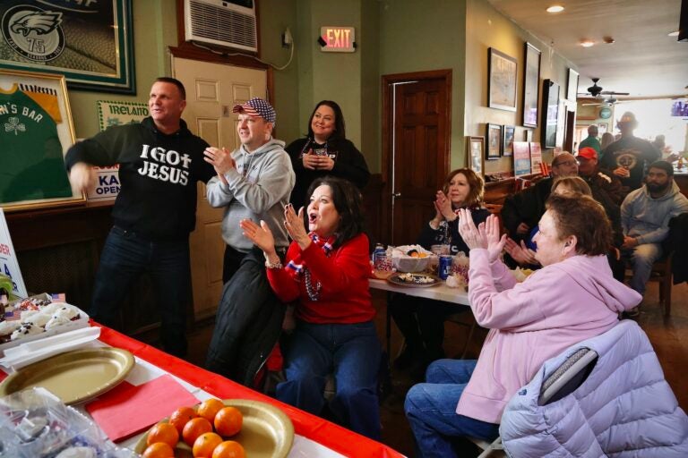 Trump supporters watching his speech in the bar