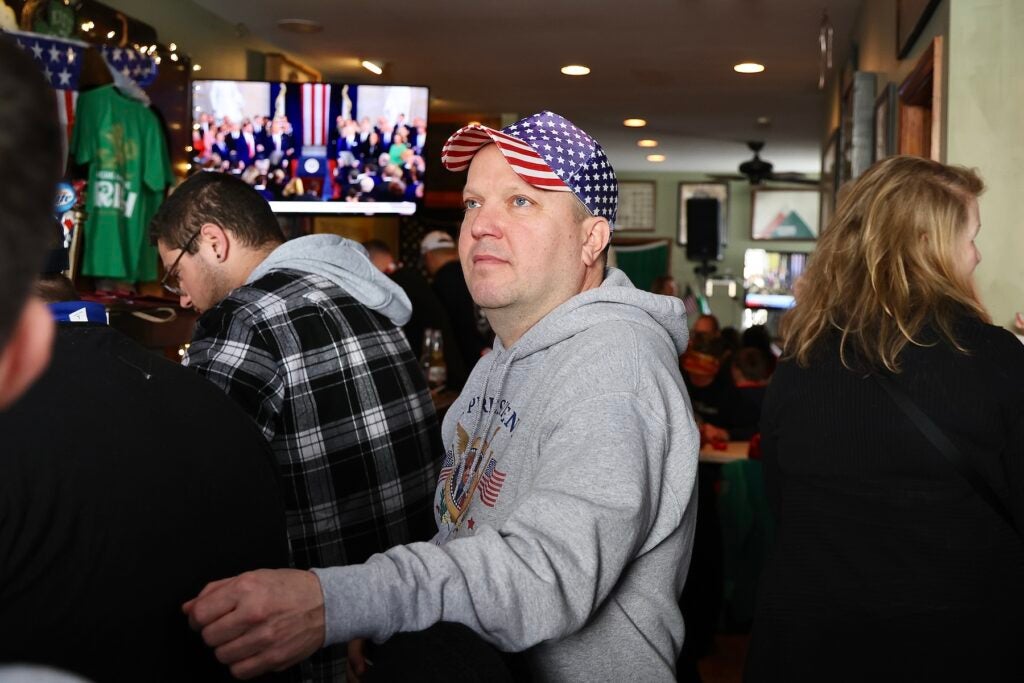 Trump supporters watching his speech in the bar