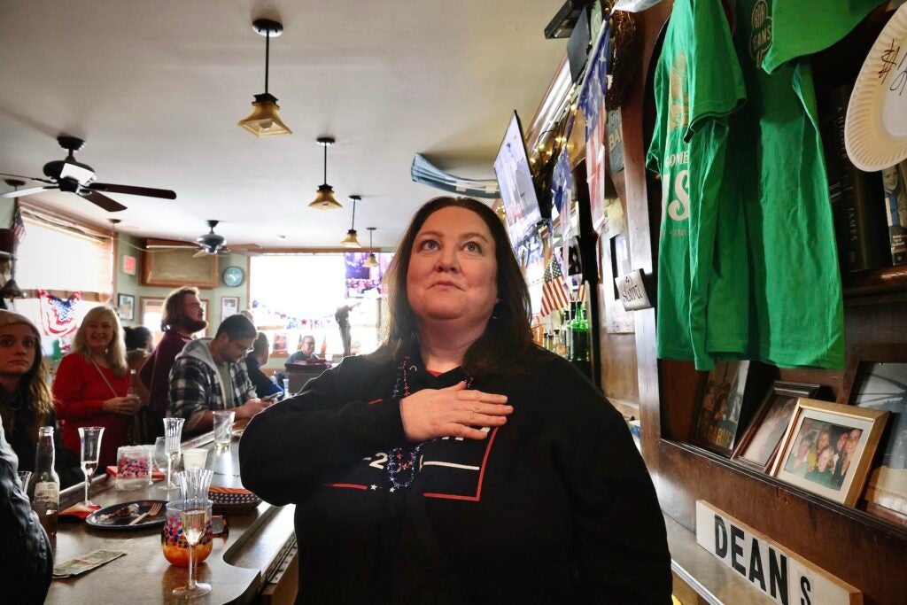 Trump supporters watching his speech in the bar