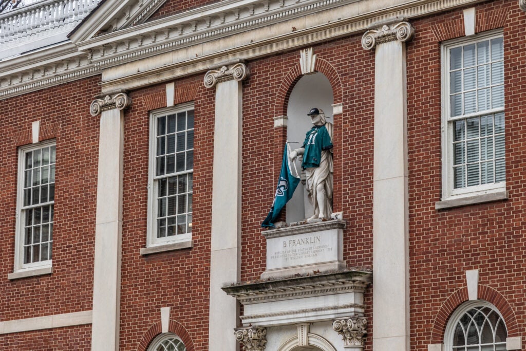 A Benjamin Franklin statue atop Philadelphia's Library Hall is outfitted in Eagles gear. 