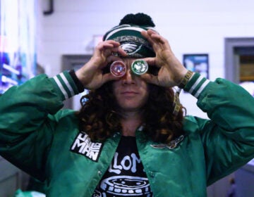 Paul Vile, aka Jelloman, holds up Jell-O shots in front of his eyes