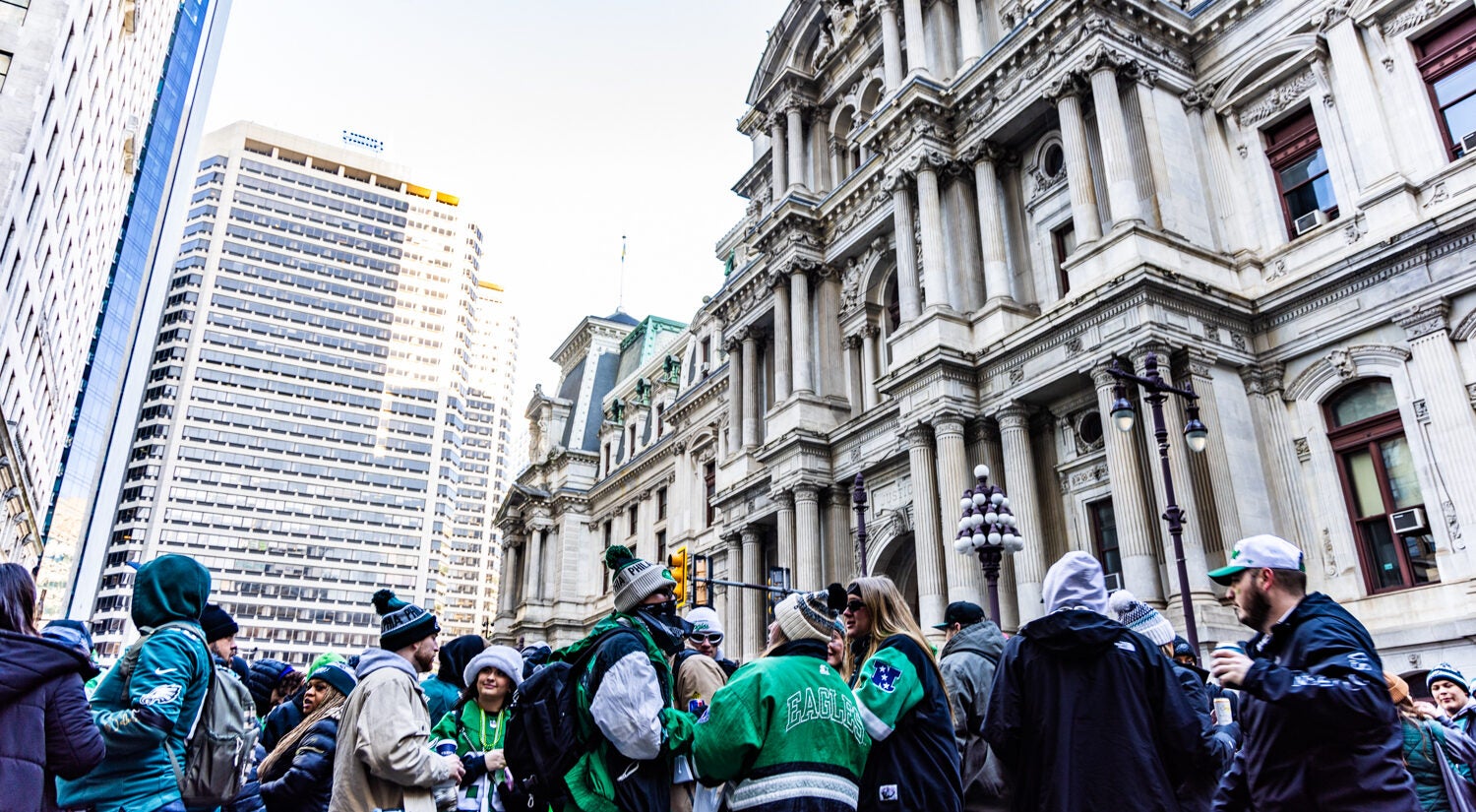 Eagles fans pack the area around City Hall in hopes of catching a glimpse of the passing parade on February 14, 2025.