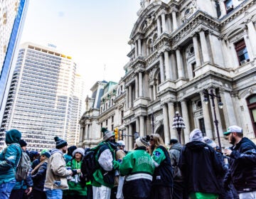 Eagles fans pack the area around City Hall in hopes of catching a glimpse of the passing parade on February 14, 2025.