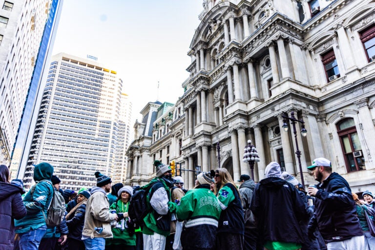 Eagles fans pack the area around City Hall in hopes of catching a glimpse of the passing parade on February 14, 2025.
