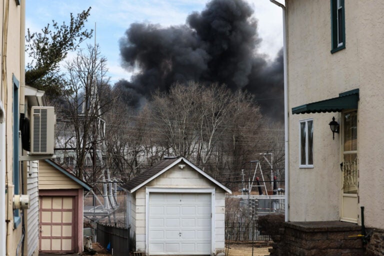 Black smoke rising in the sky from the fire