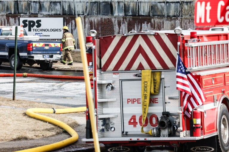 fire crews battling the fire at the warehouse