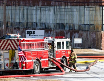 fire crews battling the fire at the warehouse