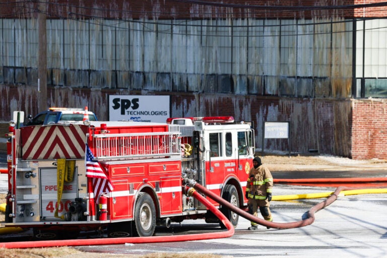 fire crews battling the fire at the warehouse