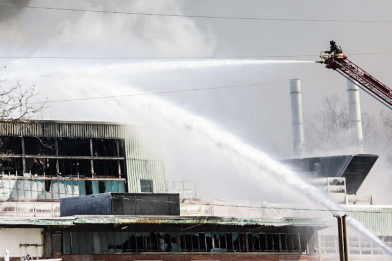 fire crews battling the fire at the warehouse