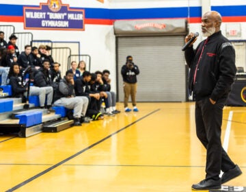 Dorrell Green addressing the audience sitting in the bleachers