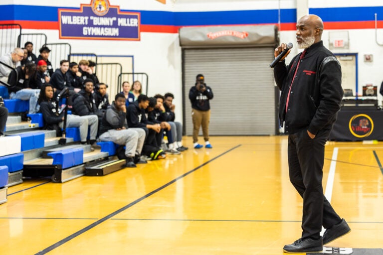 Dorrell Green addressing the audience sitting in the bleachers