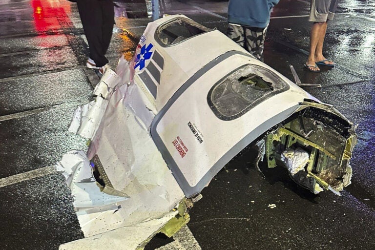 This photo provided by @Kikatechusa shows debris from a plane after crashing in Philadelphia, Friday, Jan. 31, 2025. (@Kikatechusa via AP)