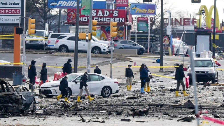 Investigators work the scene after a small plane crashed in Philadelphia, Saturday, Feb. 1, 2025. (AP Photo/Matt Rourke)