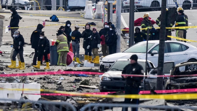 Investigators work the scene of the crash