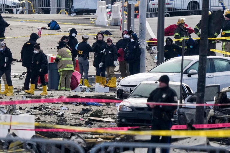 Investigators work the scene after a small plane crashed in Philadelphia, Saturday, Feb. 1, 2025. (AP Photo/Matt Rourke)