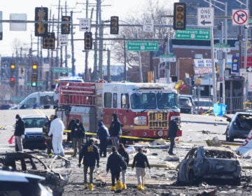 Investigators work the scene where a small plane crashed in Philadelphia, Saturday, Feb. 1, 2025. (AP Photo/Matt Rourke)