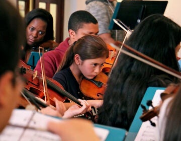 children playin stringed instruments