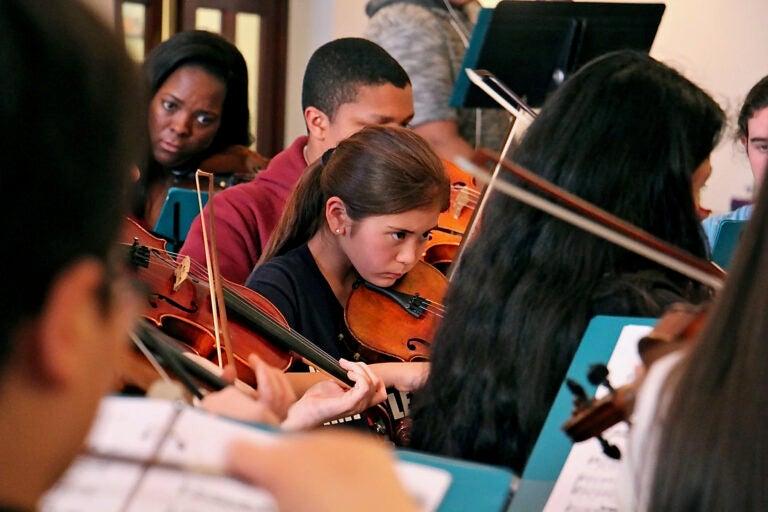 children playin stringed instruments