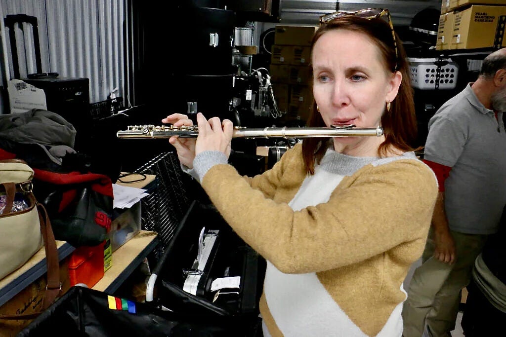 Catherine Charlton plays a flute