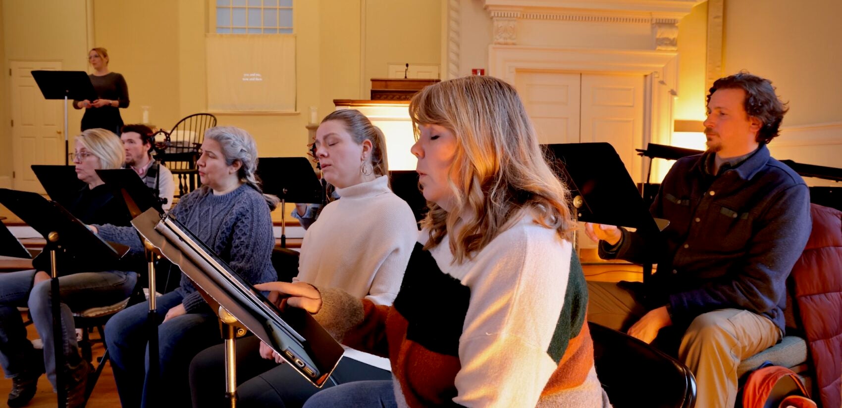 Choir members practicing in the church