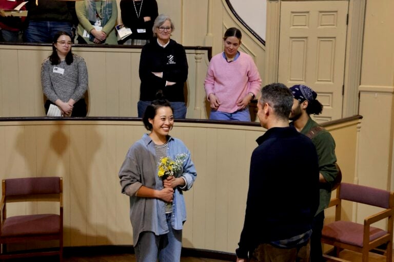 the audience watches the play