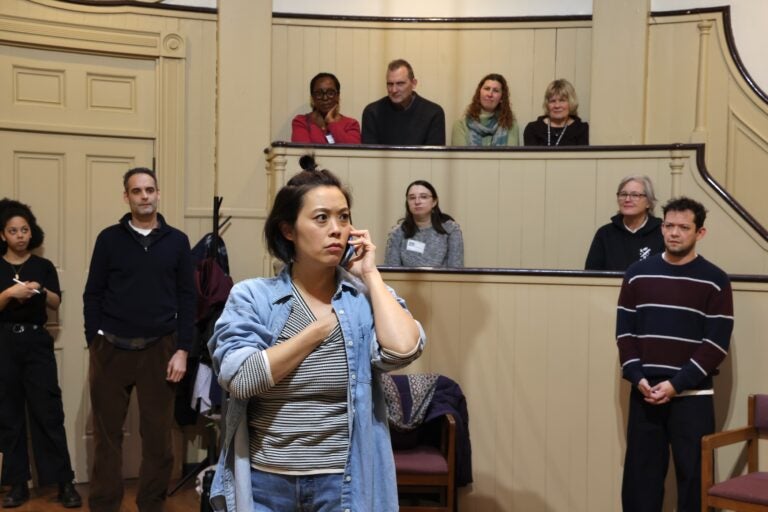 the audience watches the play