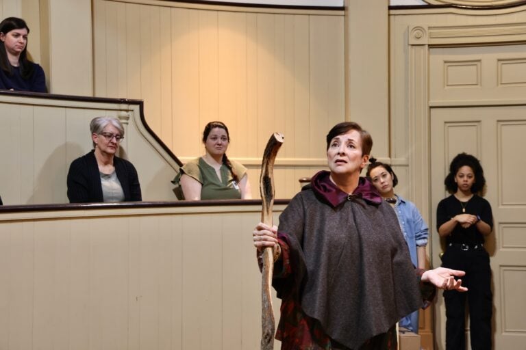 the audience watches the play