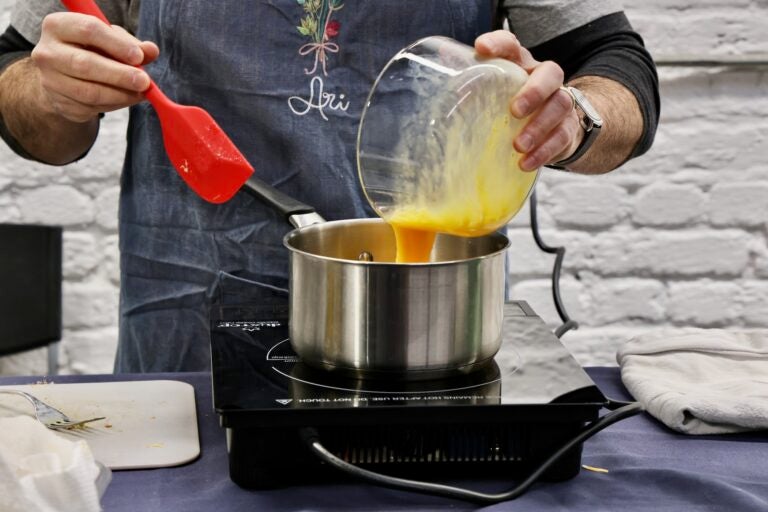 eggs being poured into a pan