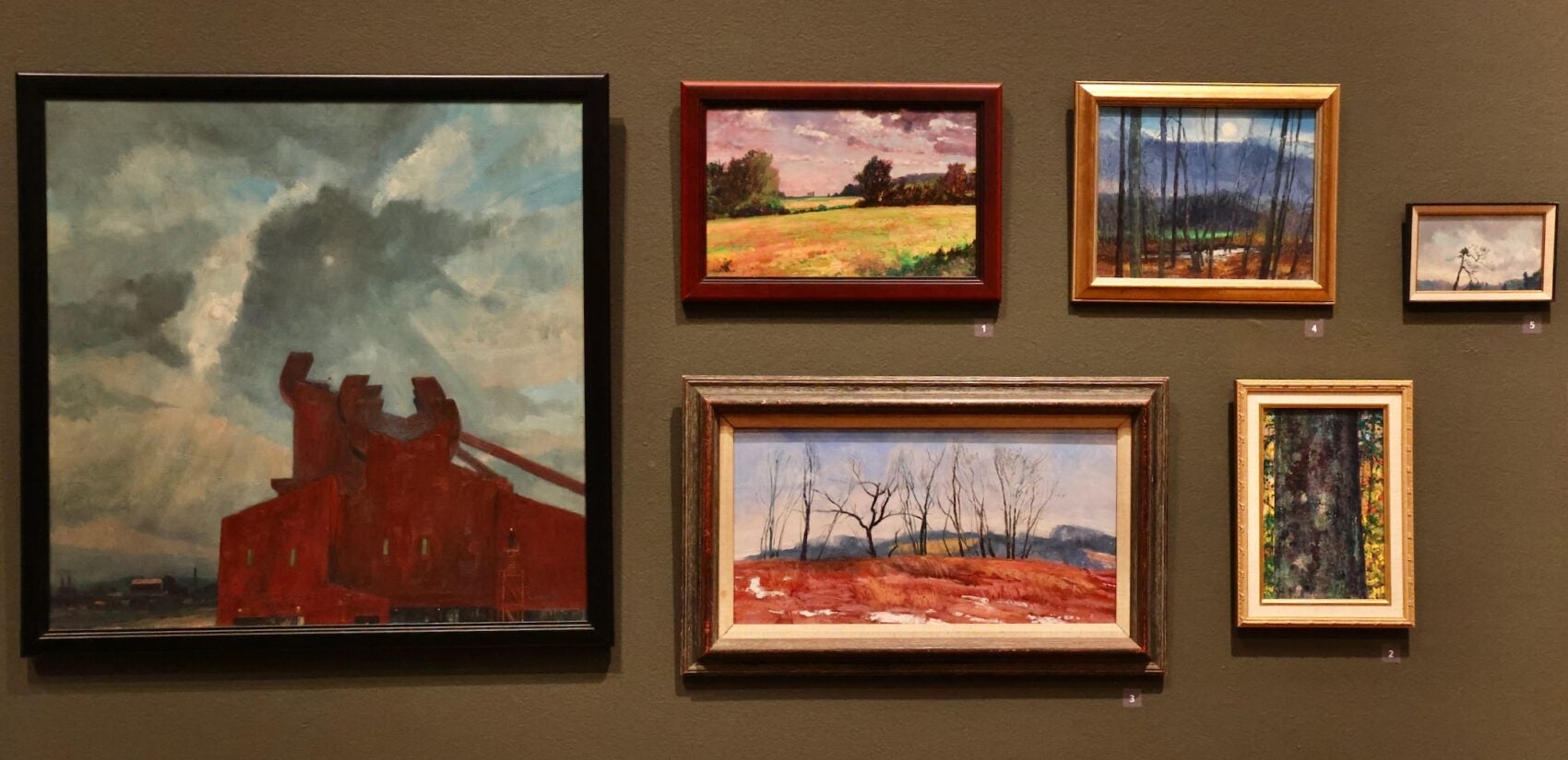 Multiple pieces of art hanging up in the exhibit