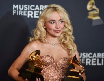 Sabrina Carpenter poses in the press room with the award for best pop solo performance, and best pop vocal album during the 67th annual Grammy Awards. (Photo by Richard Shotwell/Invision/AP)