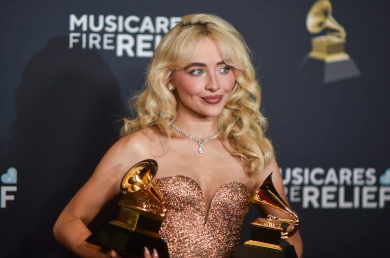 Sabrina Carpenter poses in the press room with the award for best pop solo performance, and best pop vocal album during the 67th annual Grammy Awards. (Photo by Richard Shotwell/Invision/AP)