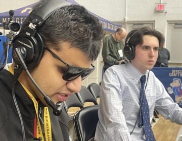 Wylie with play-by-play announcer Owen Colwell at the game