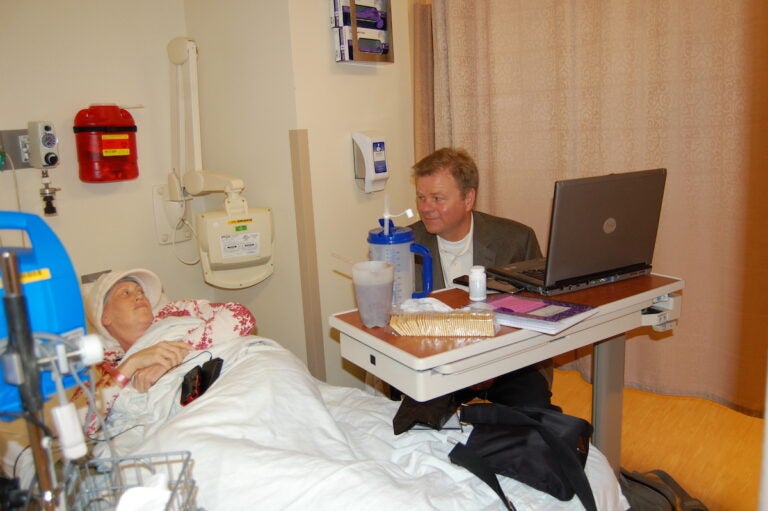 Blood cancer patient Jenny Ahlstrom and her husband Paul wait together in the hospital as Jenny prepares for a stem cell transplant treatment. (Courtesy of Jenny Ahlstrom)