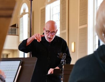 Donald Nally leading a choir