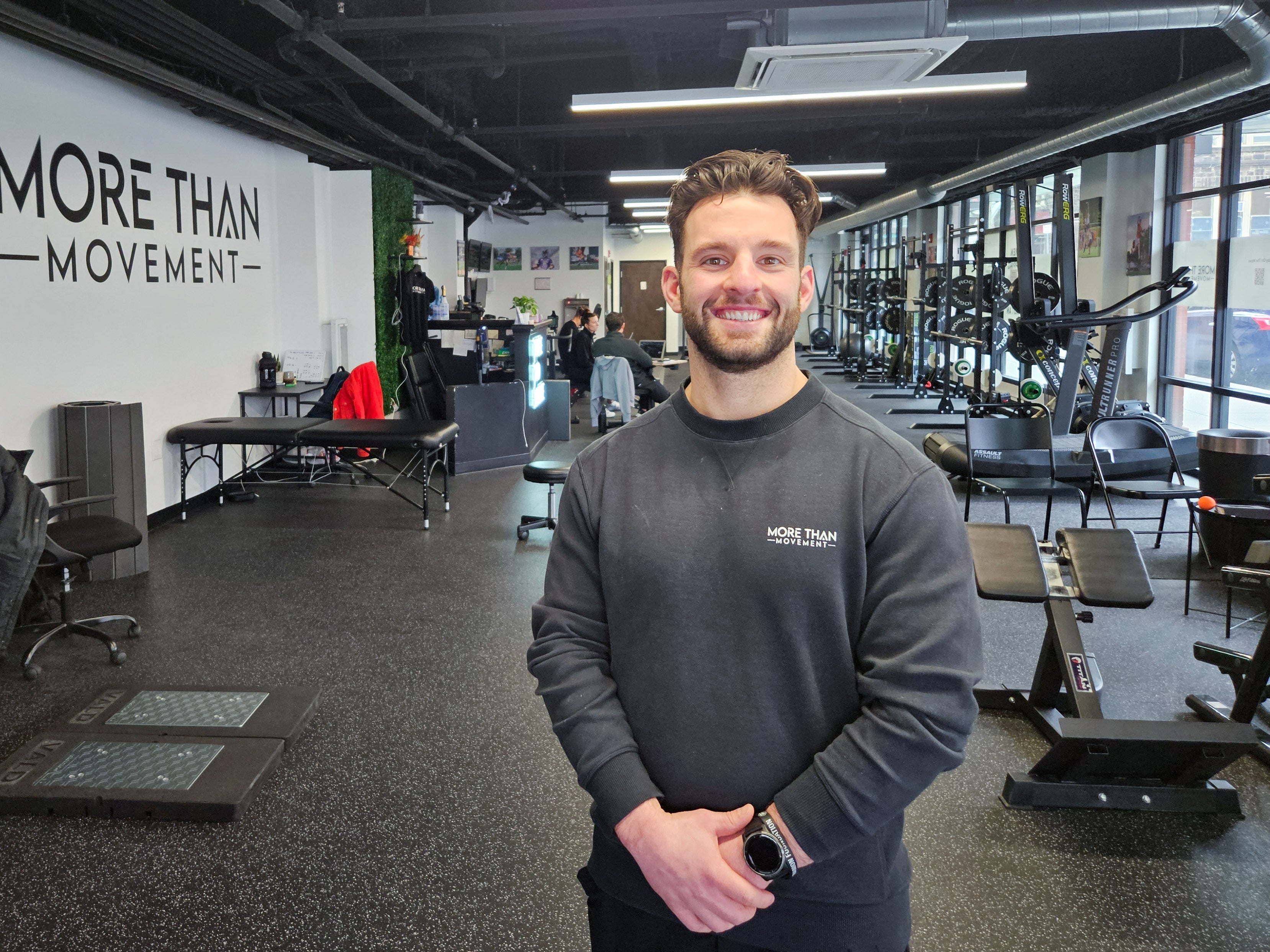 Nicholas Perugini smiles in the gym