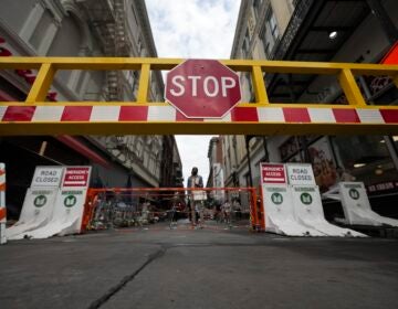 A security barrier blocks Bourbon Street