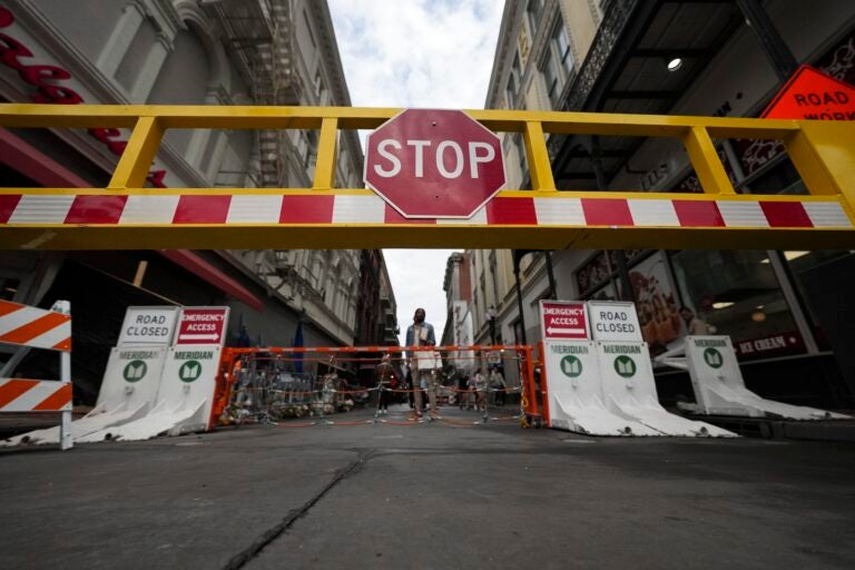 A security barrier blocks Bourbon Street