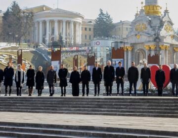 European leaders standing in a row outdoors in Kyiv showing solidarity with Ukraine