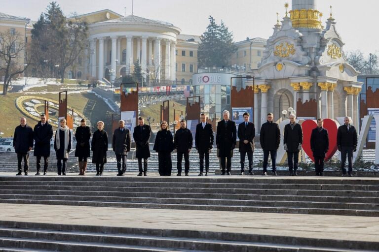 European leaders standing in a row outdoors in Kyiv showing solidarity with Ukraine