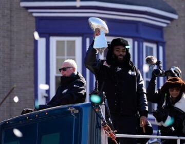 Brandon Graham holds up the trophy