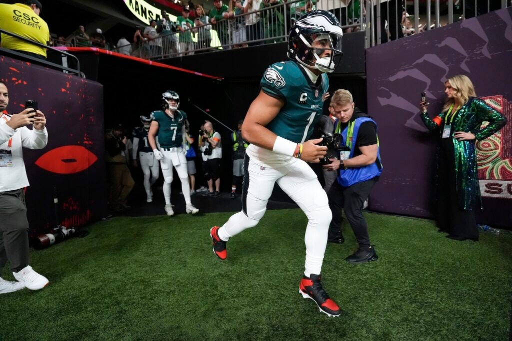 Jalen Hurts leads the Eagles onto the field before Super Bowl 59