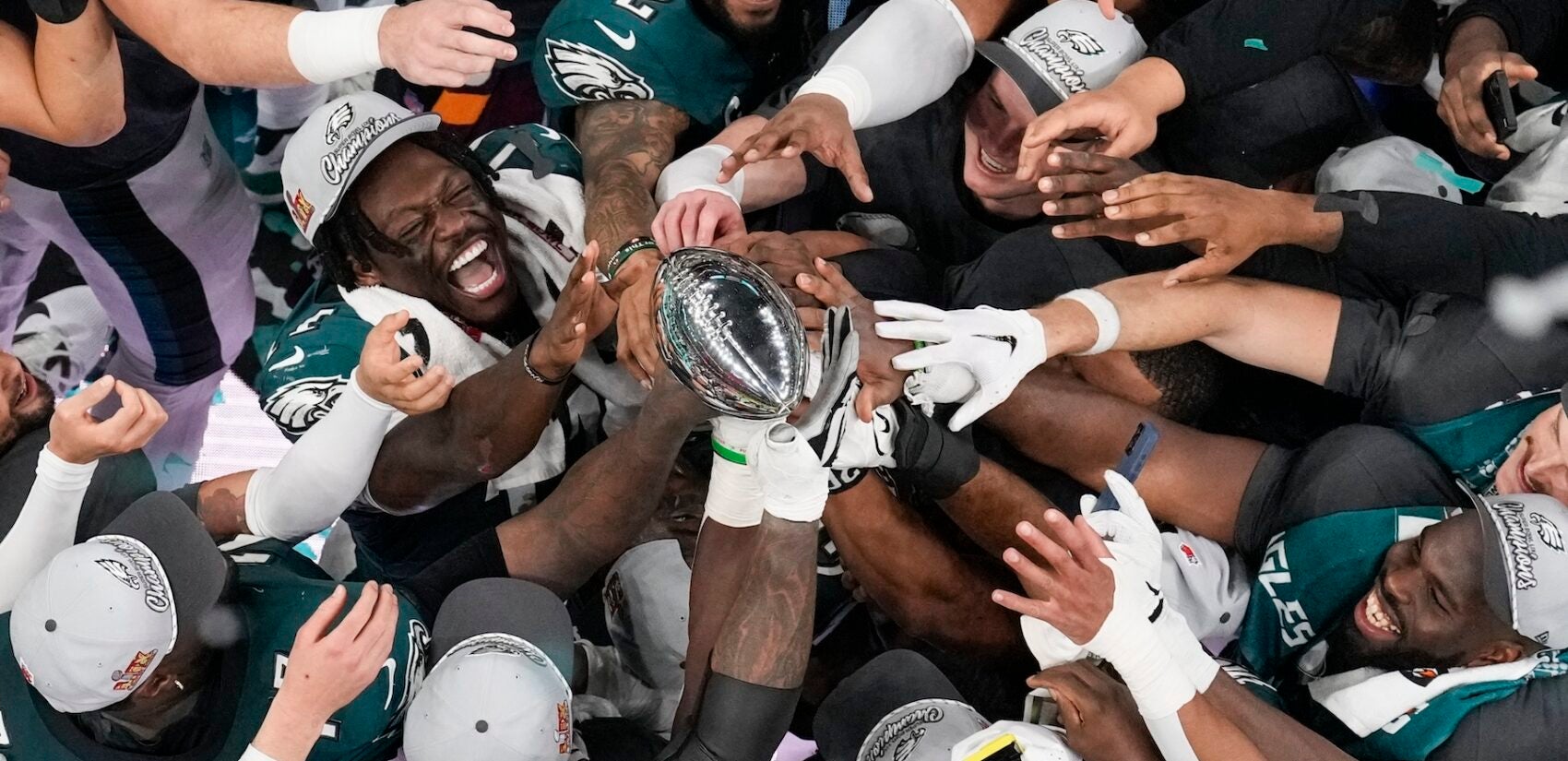 Eagles players lift the trophy