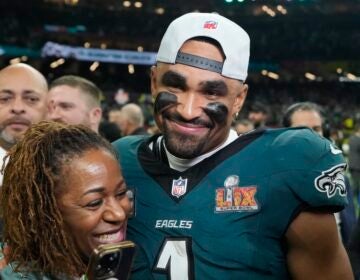 Jalen Hurts celebrates with his mother