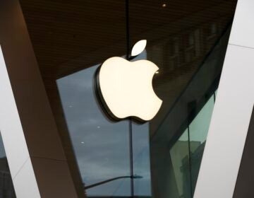 The Apple logo on the front of an Apple Store