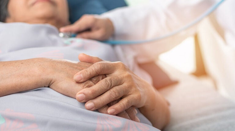 An elderly patient lying on hospital bed. (Bigstock/Rido81)