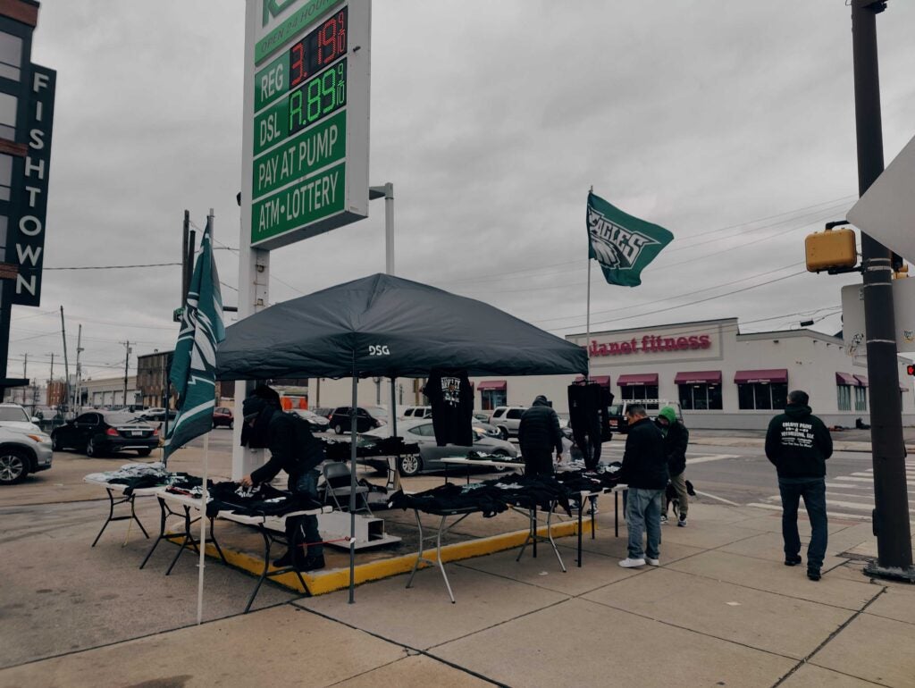 A pop-up T-shirt vendor does brisk businesses at Aramingo Avenue and York Street in Fishtown. 