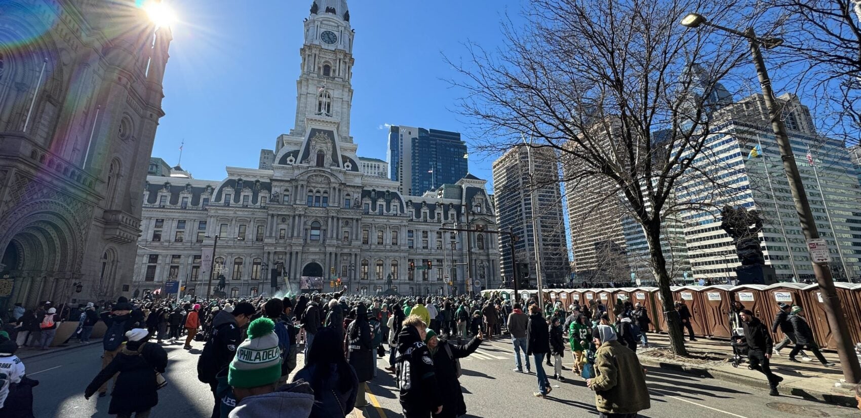 A crowd of people outside City Hall