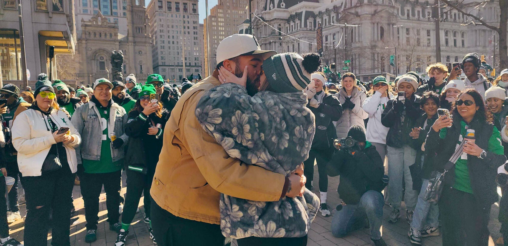 A couple kisses in LOVE Park